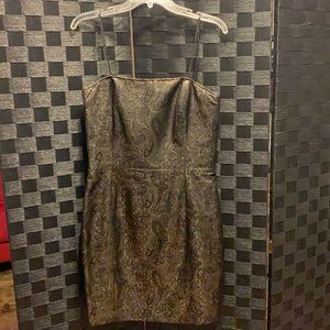 Gold cocktail dress with black accented design